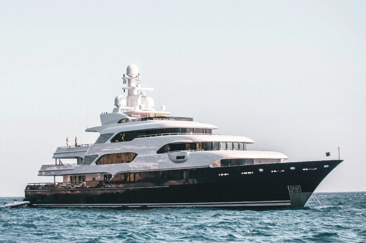 A motor yacht shown in full side profile on open water