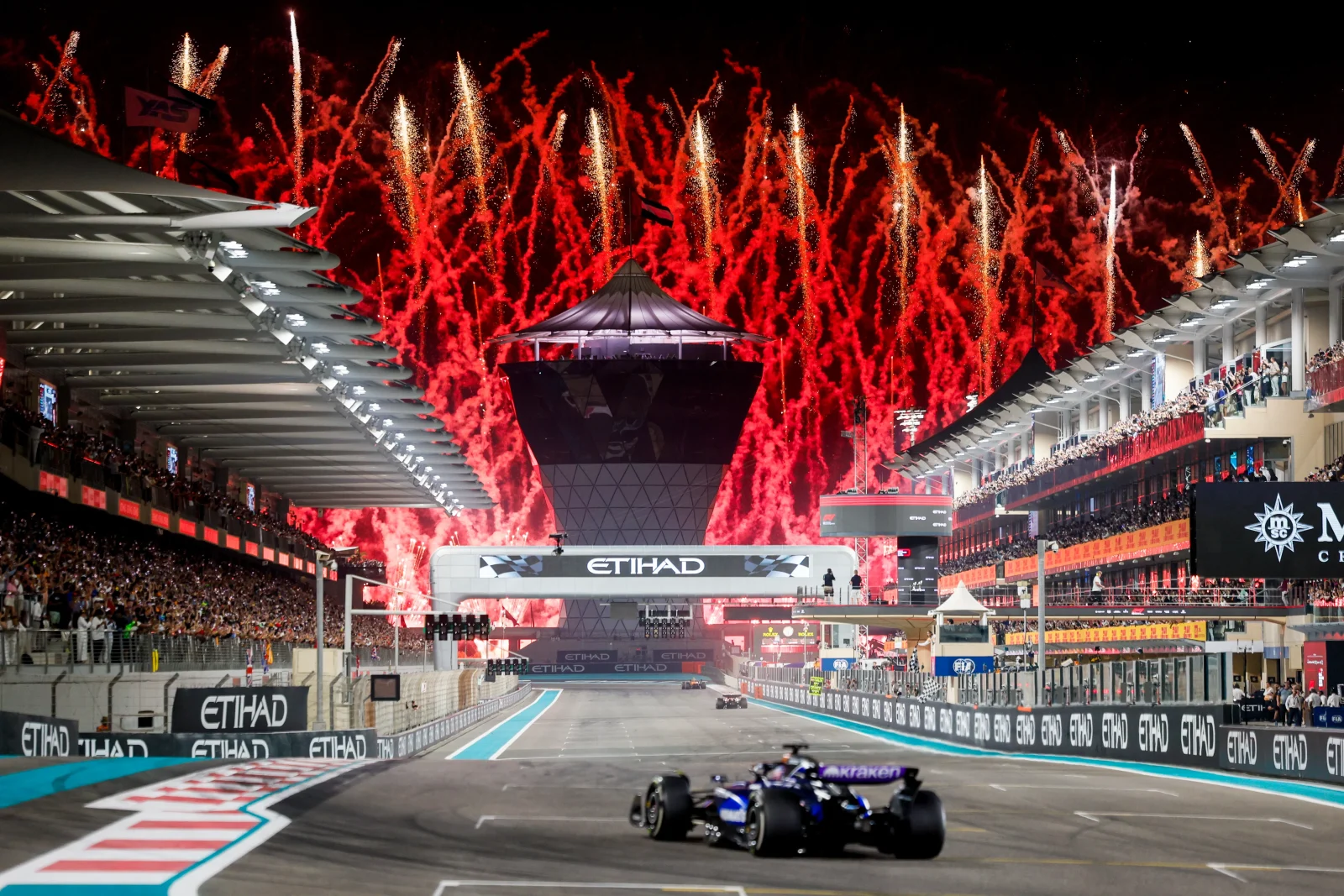 Formula 1 cars and fireworks at Yas Marina Circuit