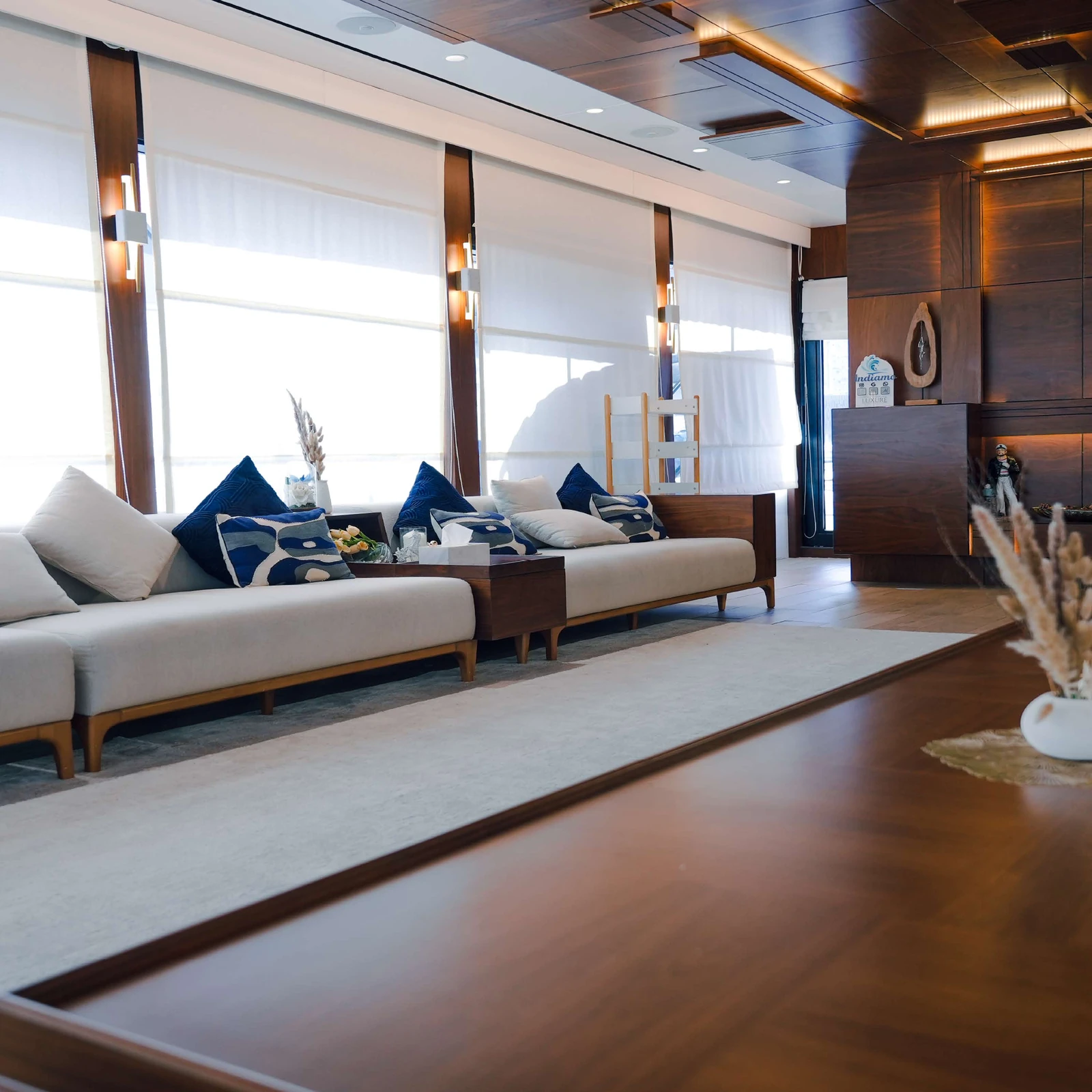 Salama lounge with cream sofas and blue cushions